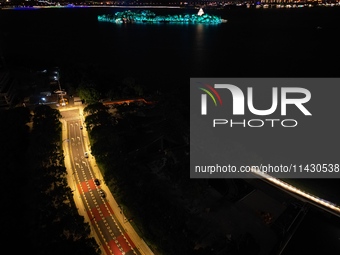 A photo is showing the night view of Moonlight Pier, a business district in Suzhou, Jiangsu province, China, on May 29, 2024. (