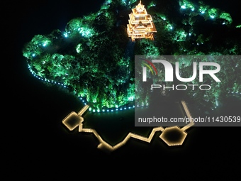 A photo is showing the night view of Moonlight Pier, a business district in Suzhou, Jiangsu province, China, on May 29, 2024. (