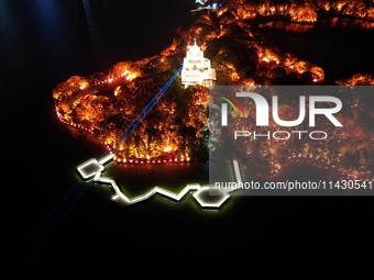 A photo is showing the night view of Moonlight Pier, a business district in Suzhou, Jiangsu province, China, on May 29, 2024. (