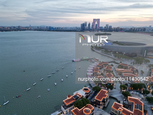 A photo is showing the night view of Moonlight Pier, a business district in Suzhou, Jiangsu province, China, on May 29, 2024. 