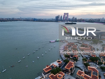 A photo is showing the night view of Moonlight Pier, a business district in Suzhou, Jiangsu province, China, on May 29, 2024. (