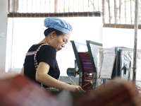 A worker is producing pencils at a production workshop in Suqian, Jiangsu province, China, on July 24, 2024. (