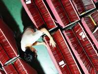 A worker is producing pencils at a production workshop in Suqian, Jiangsu province, China, on July 24, 2024. (