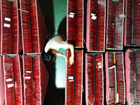 A worker is producing pencils at a production workshop in Suqian, Jiangsu province, China, on July 24, 2024. (