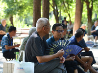 Senior citizens are relaxing at a park in Fuyang, China, on July 22, 2024. (