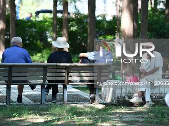 Senior citizens are relaxing at a park in Fuyang, China, on July 22, 2024. (