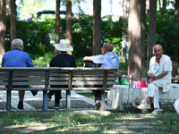 Senior citizens are relaxing at a park in Fuyang, China, on July 22, 2024. (