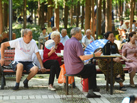 Senior citizens are relaxing at a park in Fuyang, China, on July 22, 2024. (