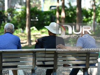 Senior citizens are relaxing at a park in Fuyang, China, on July 22, 2024. (