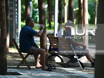 Senior citizens are relaxing at a park in Fuyang, China, on July 22, 2024. (