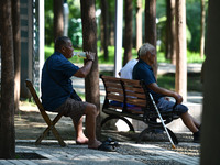 Senior citizens are relaxing at a park in Fuyang, China, on July 22, 2024. (