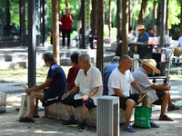 Senior citizens are relaxing at a park in Fuyang, China, on July 22, 2024. (