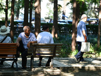 Senior citizens are relaxing at a park in Fuyang, China, on July 22, 2024. (