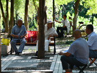 Senior citizens are relaxing at a park in Fuyang, China, on July 22, 2024. (