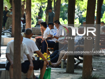 Senior citizens are relaxing at a park in Fuyang, China, on July 22, 2024. (