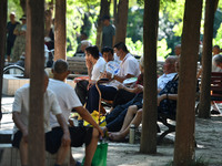 Senior citizens are relaxing at a park in Fuyang, China, on July 22, 2024. (