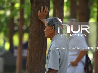 Senior citizens are relaxing at a park in Fuyang, China, on July 22, 2024. (