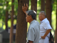 Senior citizens are relaxing at a park in Fuyang, China, on July 22, 2024. (