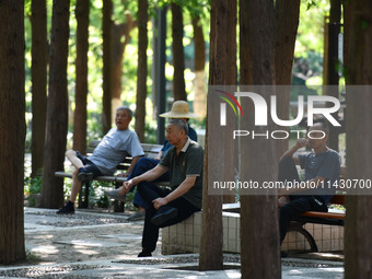 Senior citizens are relaxing at a park in Fuyang, China, on July 22, 2024. (