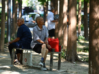 Senior citizens are relaxing at a park in Fuyang, China, on July 22, 2024. (