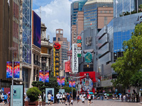 Tourists are traveling along the Nanjing Road pedestrian street in Shanghai, China, on July 24, 2024. (