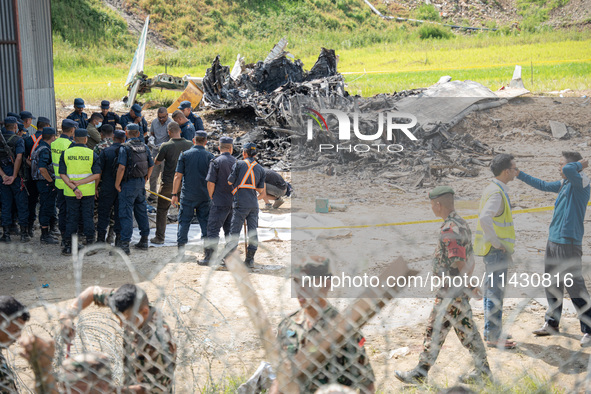 The wreckage of the Saurya Airlines plane is lying at Tribhuvan International Airport (TIA) in Kathmandu, Nepal, on Wednesday morning. Out o...