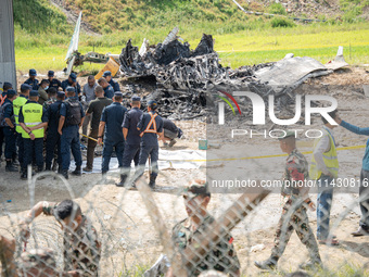 The wreckage of the Saurya Airlines plane is lying at Tribhuvan International Airport (TIA) in Kathmandu, Nepal, on Wednesday morning. Out o...