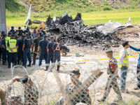 The wreckage of the Saurya Airlines plane is lying at Tribhuvan International Airport (TIA) in Kathmandu, Nepal, on Wednesday morning. Out o...