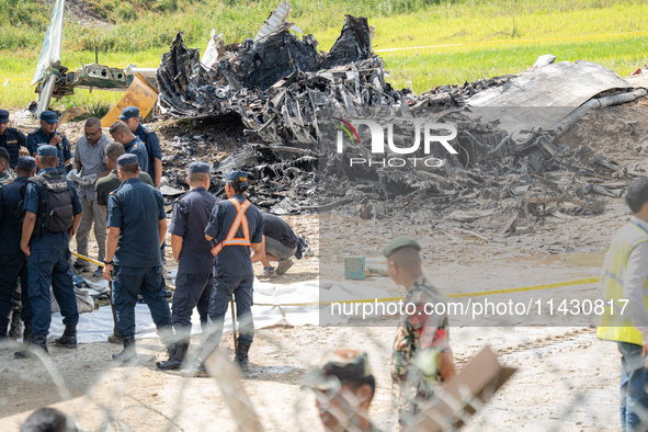 The wreckage of the Saurya Airlines plane is lying at Tribhuvan International Airport (TIA) in Kathmandu, Nepal, on Wednesday morning. Out o...