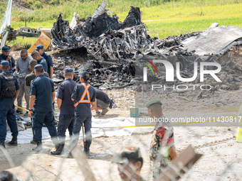 The wreckage of the Saurya Airlines plane is lying at Tribhuvan International Airport (TIA) in Kathmandu, Nepal, on Wednesday morning. Out o...