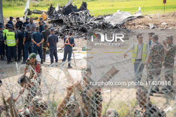 The wreckage of the Saurya Airlines plane is lying at Tribhuvan International Airport (TIA) in Kathmandu, Nepal, on Wednesday morning. Out o...