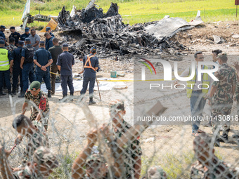 The wreckage of the Saurya Airlines plane is lying at Tribhuvan International Airport (TIA) in Kathmandu, Nepal, on Wednesday morning. Out o...