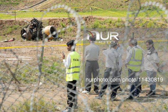 The wreckage of the Saurya Airlines plane is lying at Tribhuvan International Airport (TIA) in Kathmandu, Nepal, on Wednesday morning. Out o...