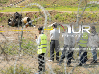 The wreckage of the Saurya Airlines plane is lying at Tribhuvan International Airport (TIA) in Kathmandu, Nepal, on Wednesday morning. Out o...