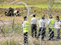 The wreckage of the Saurya Airlines plane is lying at Tribhuvan International Airport (TIA) in Kathmandu, Nepal, on Wednesday morning. Out o...