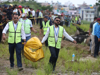 Officials from the Civil Aviation Authority of Nepal (CAAN) are retrieving the black box of the passenger aircraft of Saurya Airlines that c...