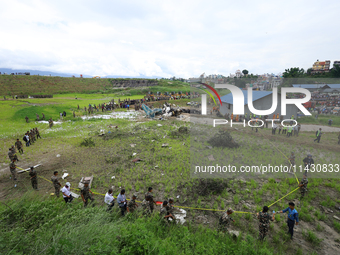 The Nepal Army is cordoning off the crash site of Saurya Airlines, a domestic flight carrier that crashed in Tribhuvan International Airport...