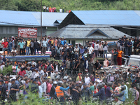 Locals are gathering outside the Tribhuvan International Airport after a passenger aircraft is crashing in Kathmandu, Nepal, on July 24, 202...