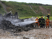 Rescuers from Nepal's security agencies are salvaging the remains of a passenger aircraft of Saurya Airlines that crashed at Tribhuvan Inter...