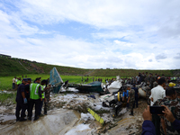 Rescuers from Nepal's security agencies are salvaging the remains of a passenger aircraft of Saurya Airlines that crashed at Tribhuvan Inter...