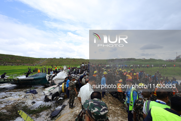 Rescuers from Nepal's security agencies are salvaging the remains of a passenger aircraft of Saurya Airlines that crashed at Tribhuvan Inter...