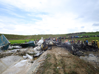 Rescuers from Nepal's security agencies are salvaging the remains of a passenger aircraft of Saurya Airlines that crashed at Tribhuvan Inter...