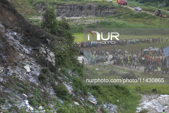 Rescuers from Nepal's security agencies are salvaging the remains of a passenger aircraft of Saurya Airlines that crashed at Tribhuvan Inter...