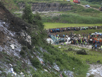 Rescuers from Nepal's security agencies are salvaging the remains of a passenger aircraft of Saurya Airlines that crashed at Tribhuvan Inter...