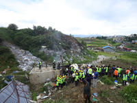 Rescuers from Nepal's security agencies are salvaging the remains of a passenger aircraft of Saurya Airlines that crashed at Tribhuvan Inter...