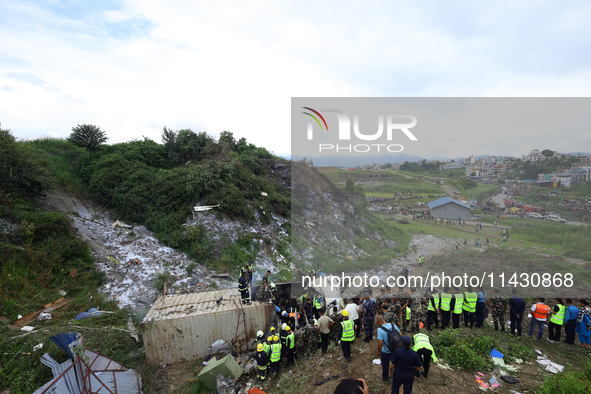 Rescuers from Nepal's security agencies are salvaging the remains of a passenger aircraft of Saurya Airlines that crashed at Tribhuvan Inter...