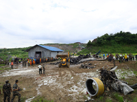 Rescuers from Nepal's security agencies are salvaging the remains of a passenger aircraft of Saurya Airlines that crashed at Tribhuvan Inter...