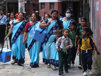 Health workers are walking during a polio vaccination campaign in Patan, Lalitpur, on July 24, 2024. The Nepal government is starting a four...