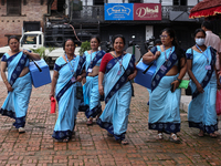 Health workers are walking during a polio vaccination campaign in Patan, Lalitpur, on July 24, 2024. The Nepal government is starting a four...