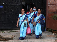 Health workers are walking during a polio vaccination campaign in Patan, Lalitpur, on July 24, 2024. The Nepal government is starting a four...